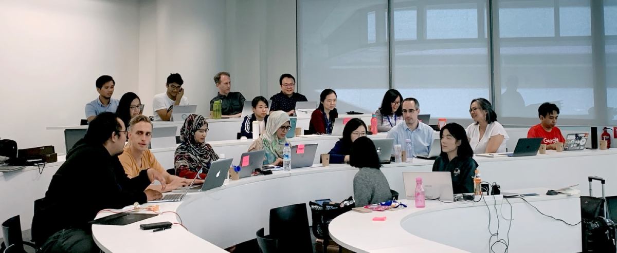 classroom people sitting on chair in front of table